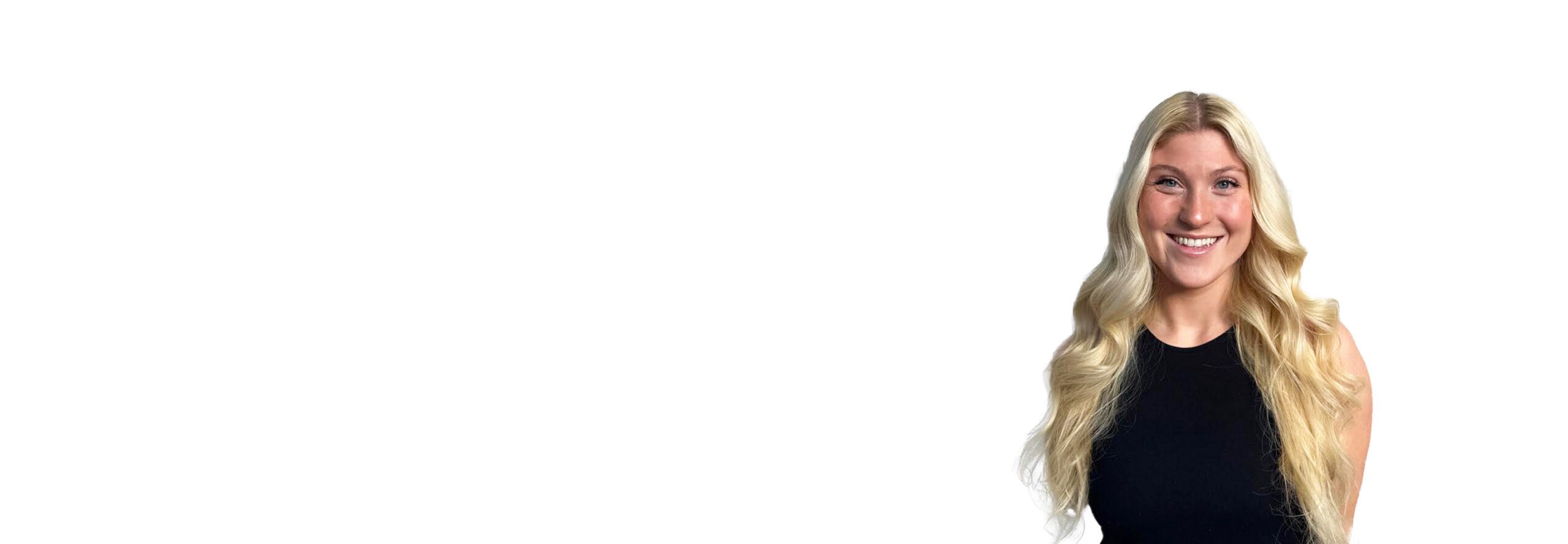 Barry's instructor standing confidently wearing a black top against a white background.