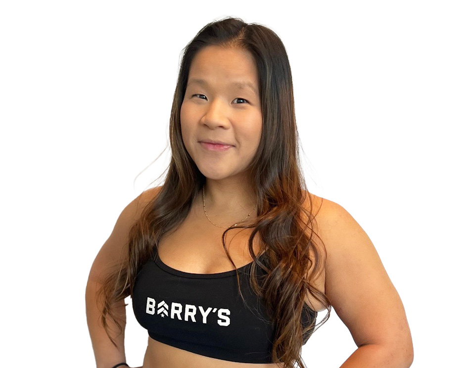 Barry's instructor standing confidently wearing a black top against a white background.