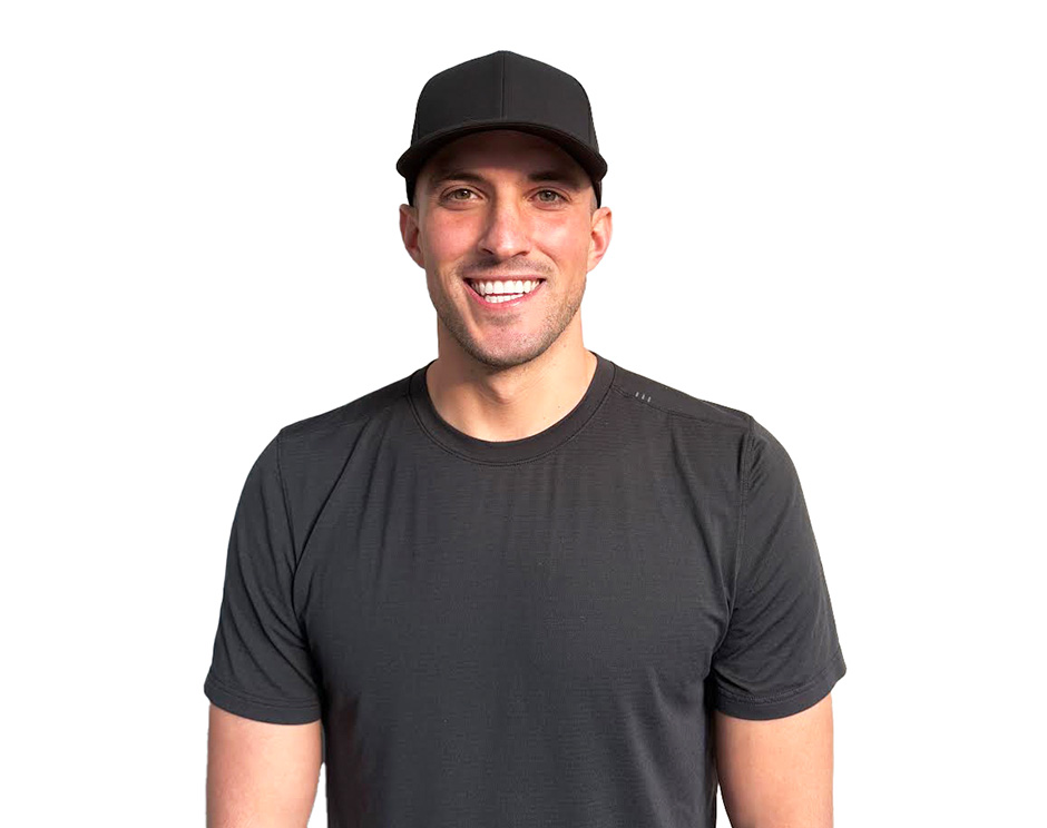 Barry's instructor standing confidently wearing a black top against a white background.