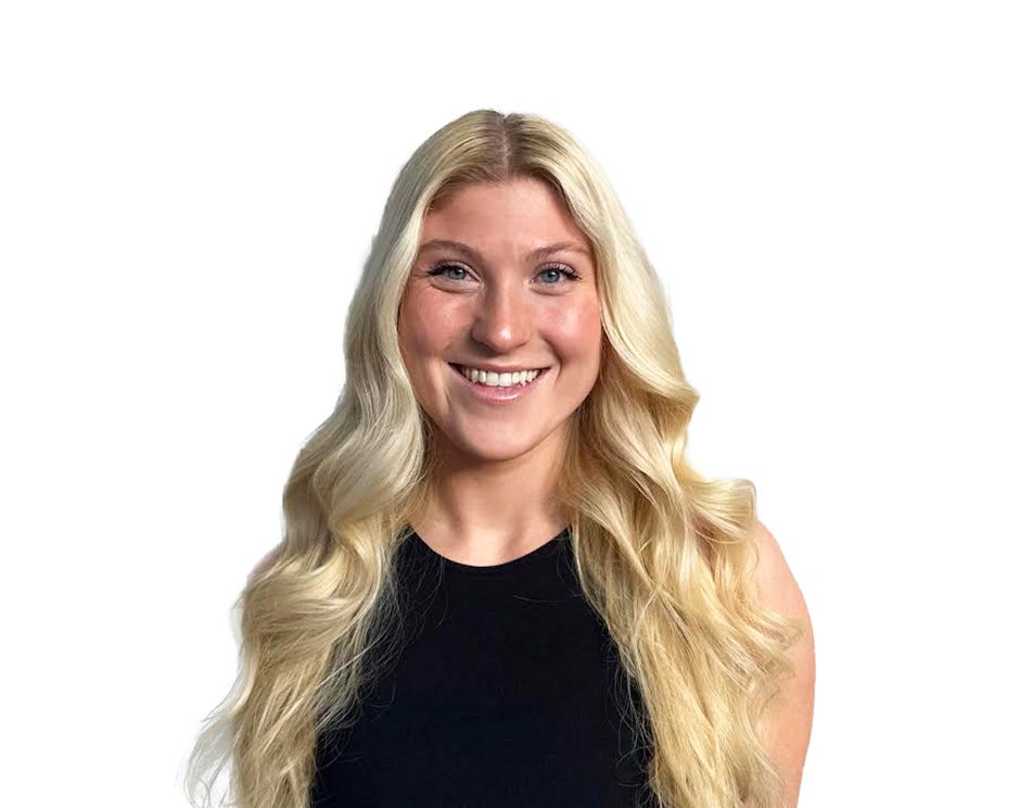 Barry's instructor standing confidently wearing a black top against a white background.