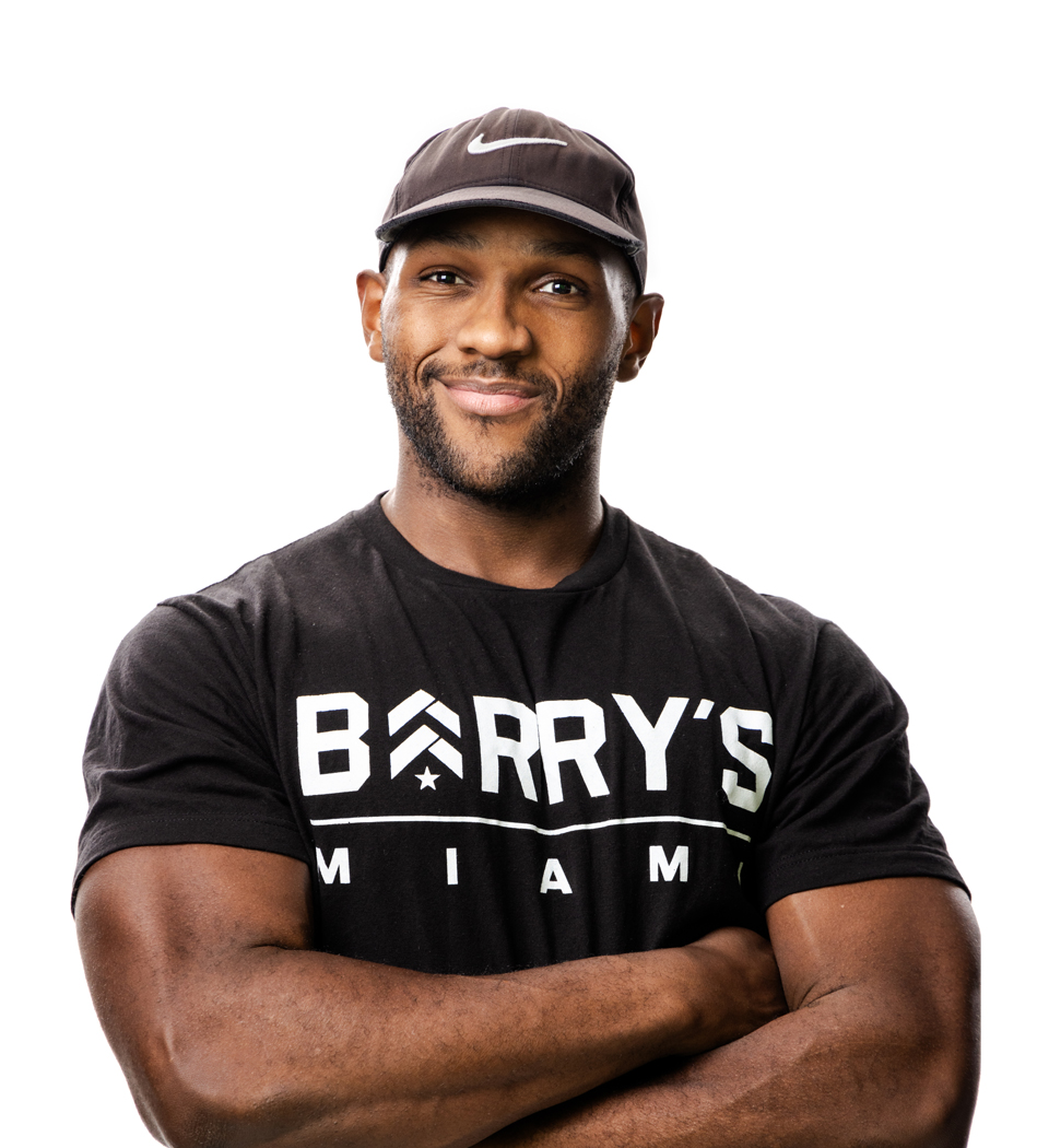 Barry's instructor standing confidently wearing a black top against a white background.