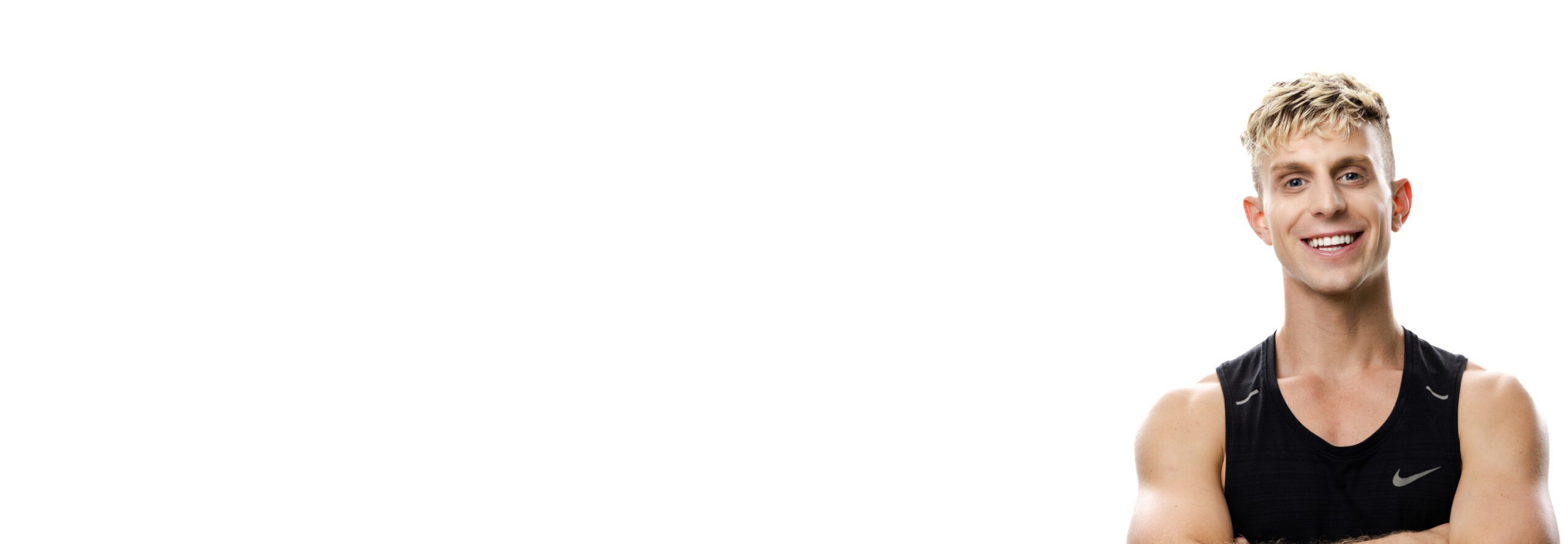 Barry's instructor standing confidently wearing a black top against a white background.