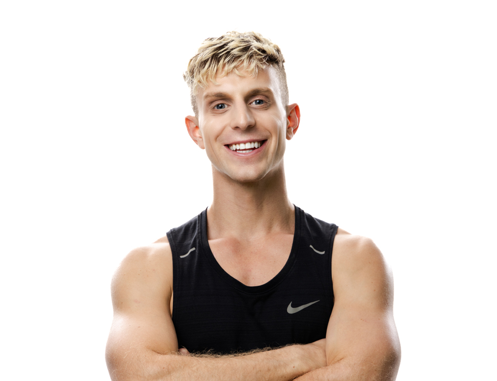 Barry's instructor standing confidently wearing a black top against a white background.