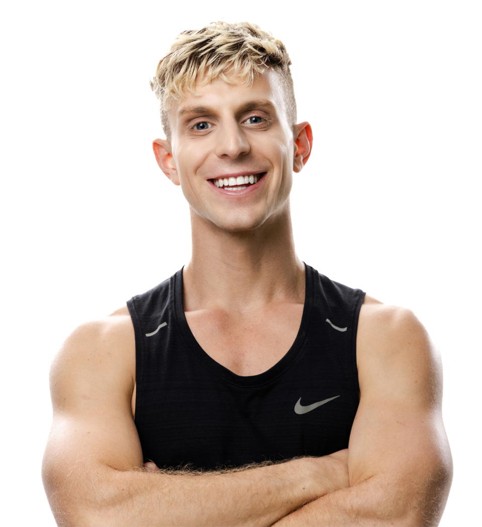 Barry's instructor standing confidently wearing a black top against a white background.