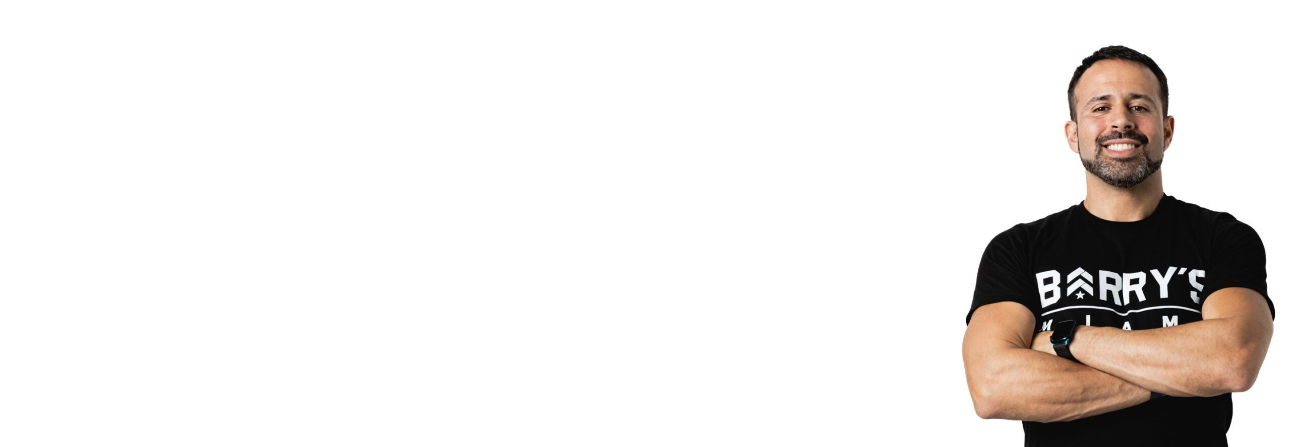 Barry's instructor standing confidently wearing a black top against a white background.