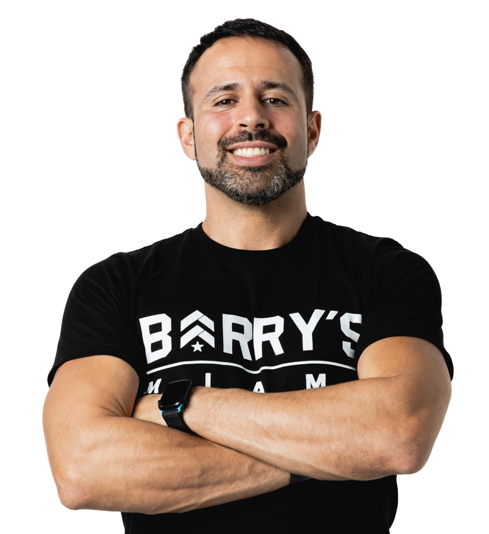 Barry's instructor standing confidently wearing a black top against a white background.