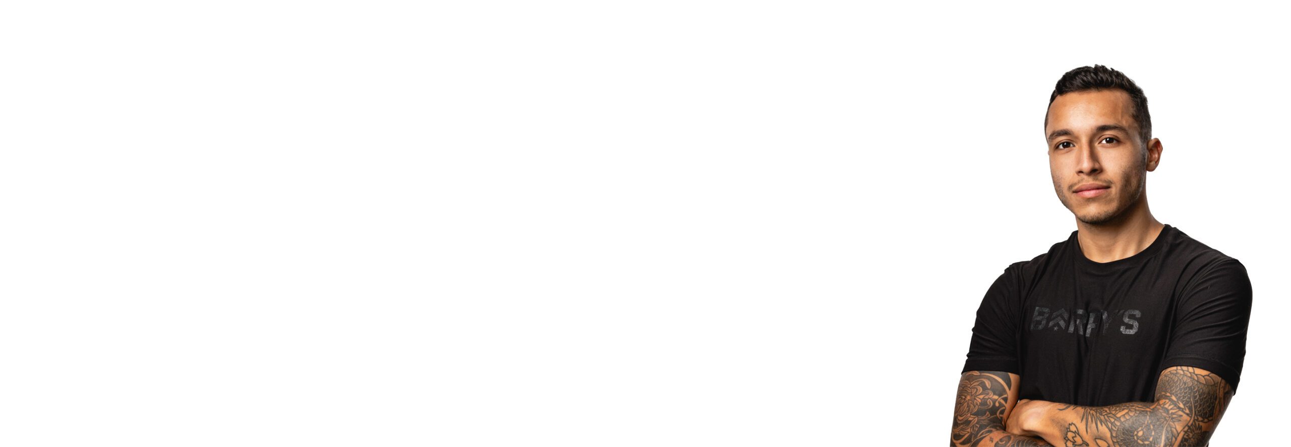 Barry's instructor standing confidently wearing a black top against a white background.