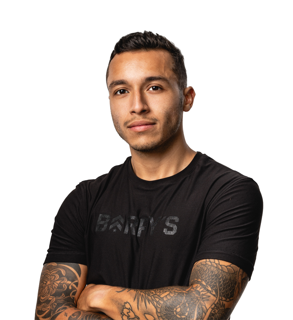 Barry's instructor standing confidently wearing a black top against a white background.