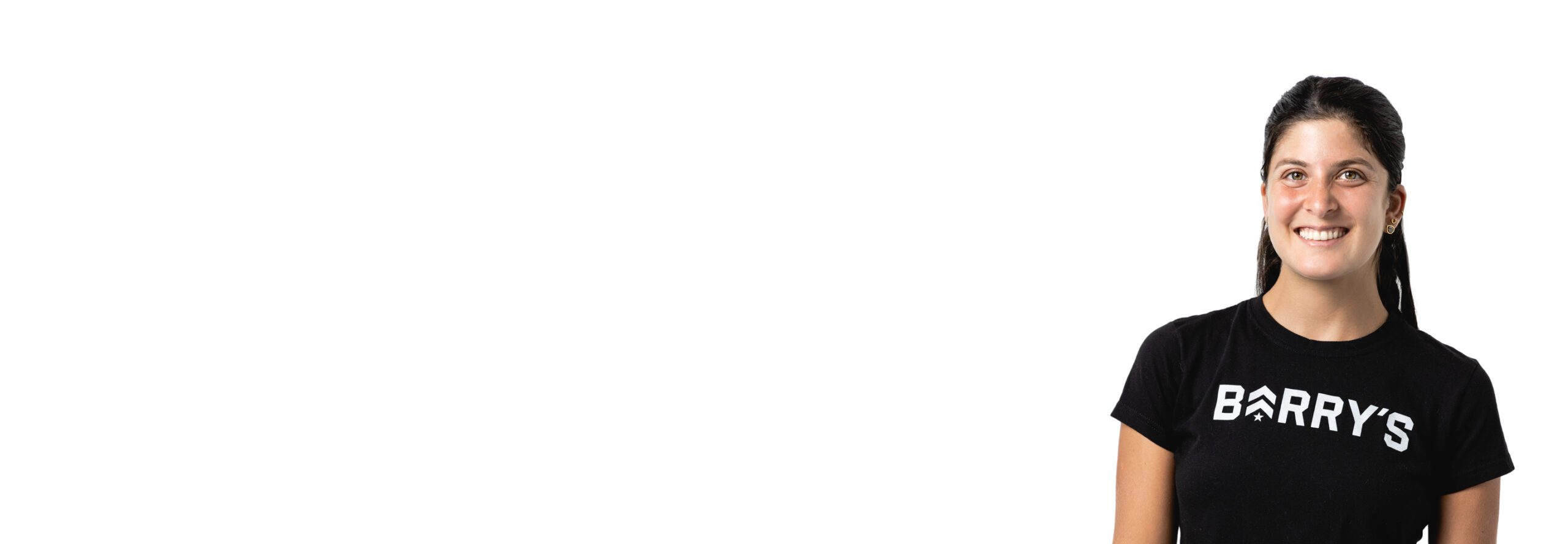 Barry's instructor standing confidently wearing a black top against a white background.