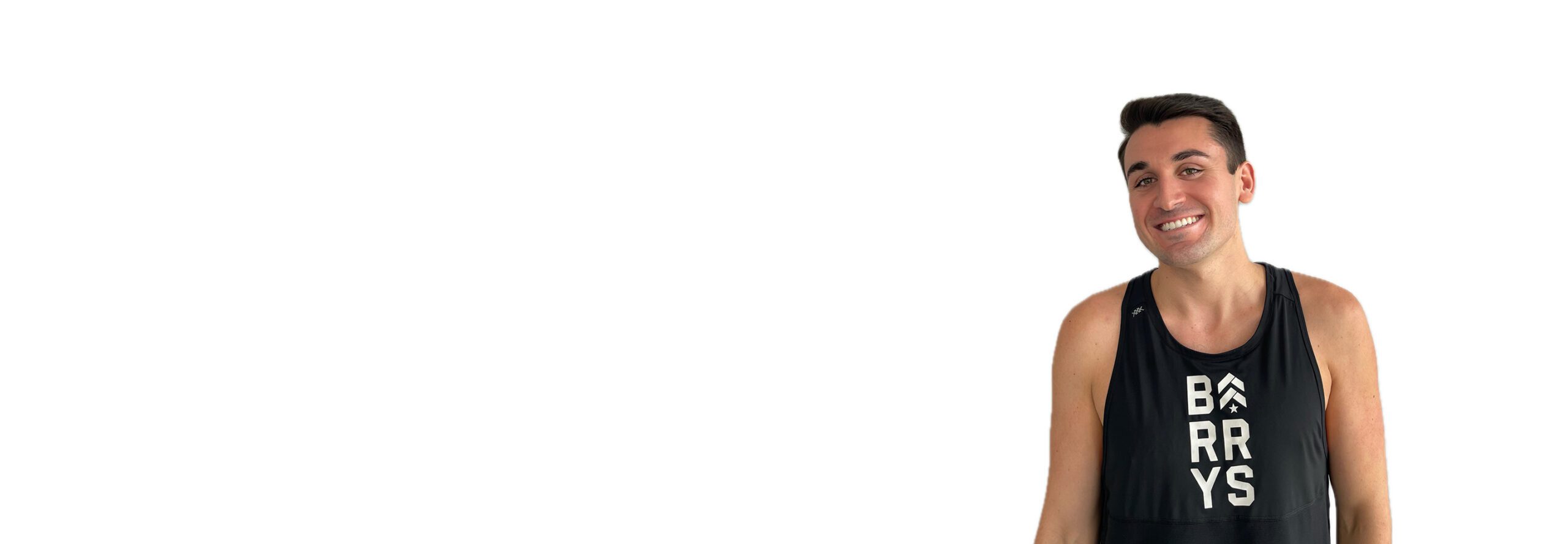 Barry's instructor standing confidently wearing a black top against a white background.