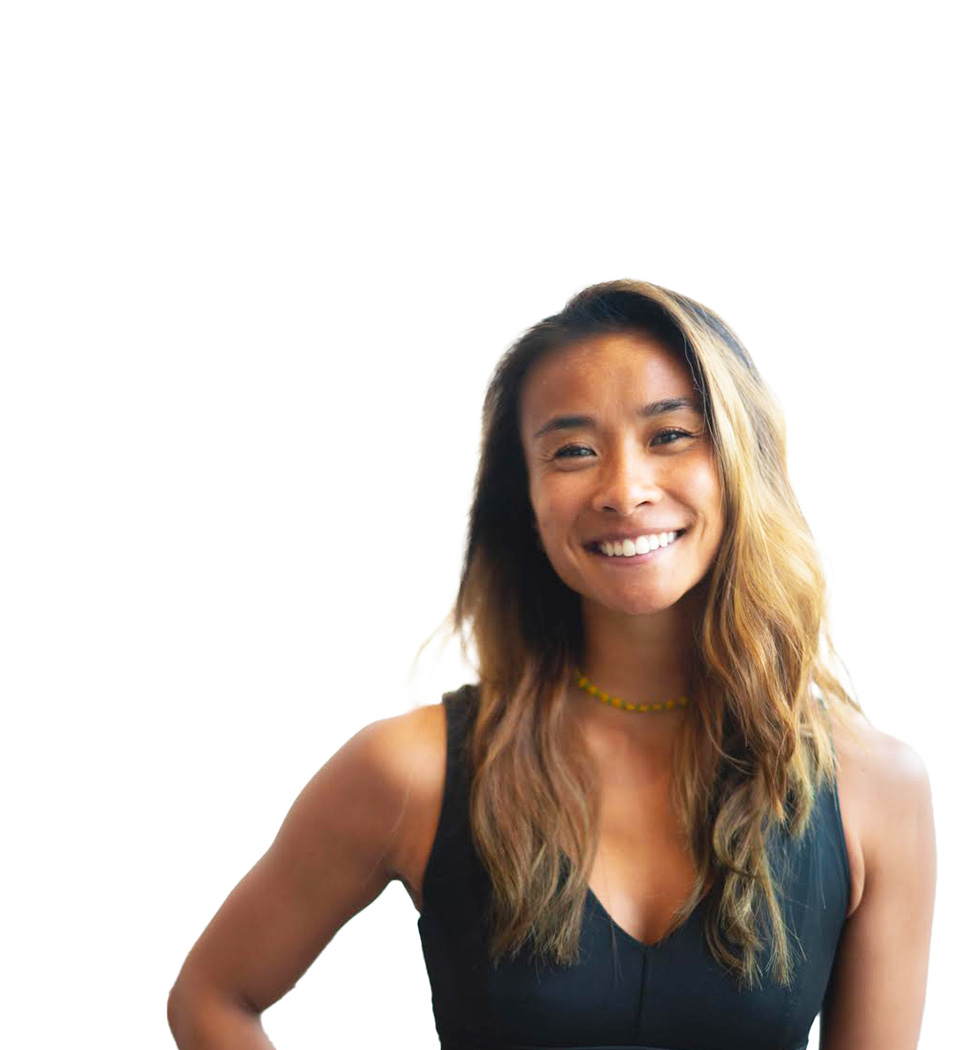 Barry's instructor standing confidently, wearing a black tank top against a white background, ready for the next workout challenge.